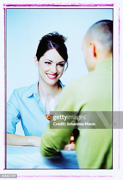couple drinking wine, view over man's shoulder - half updo stock pictures, royalty-free photos & images