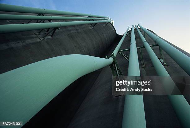 cement plant silos and transfer pipes, low angle view - crystal river florida stock-fotos und bilder