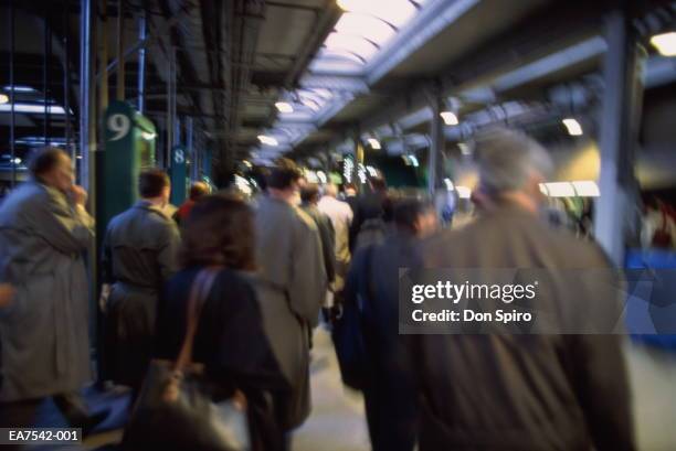 rush-hour commuters in train station, usa (blurred motion) - spirou stock pictures, royalty-free photos & images