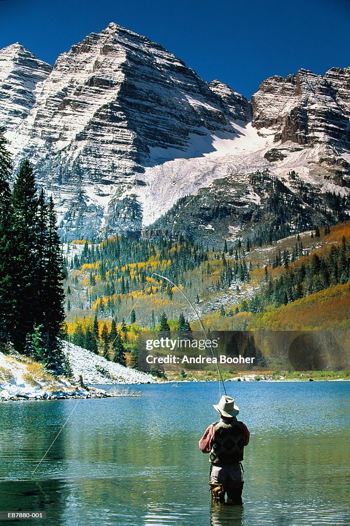 USA, Colorado, Aspen, man fly-fishing in Maroon Lake