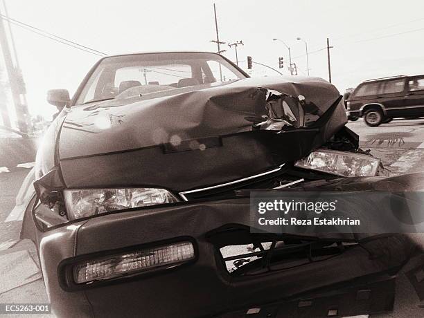 car accident on street, close-up (digital enhancement) - car crash scene stock-fotos und bilder
