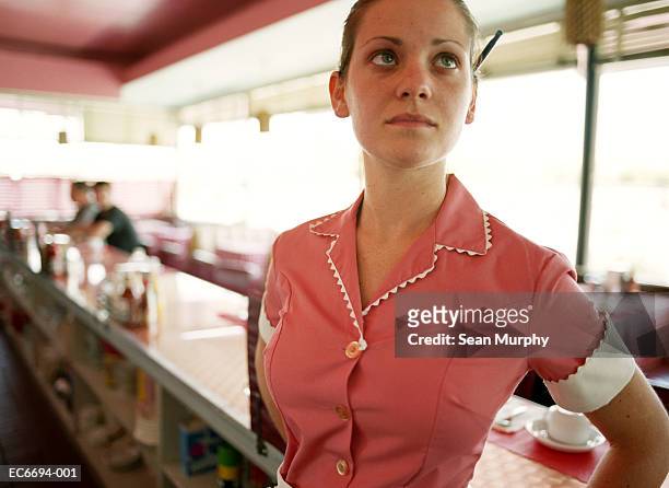 waitress behind counter in diner - ウエイトレス ストックフォトと画像