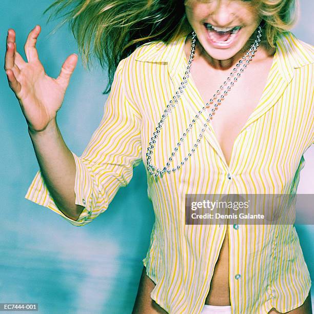 woman in yellow pinstripe shirt screaming (enhancement) - femme décolleté photos et images de collection