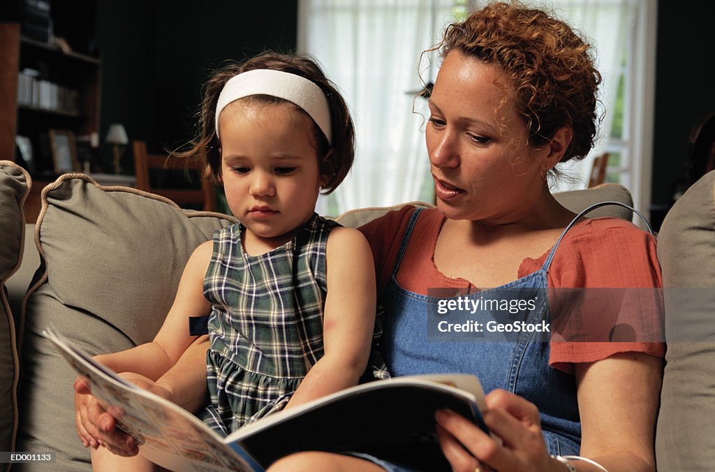 Mother Teaching Daughter to Read