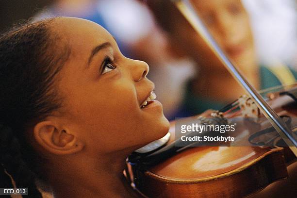 girl playing violin - young violinist stock pictures, royalty-free photos & images