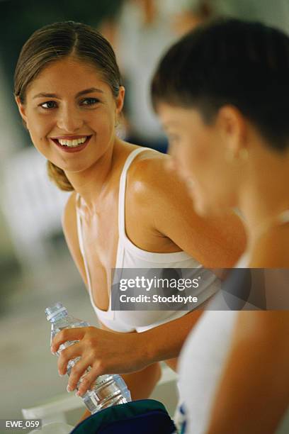 two women talking - flirting gym stock pictures, royalty-free photos & images