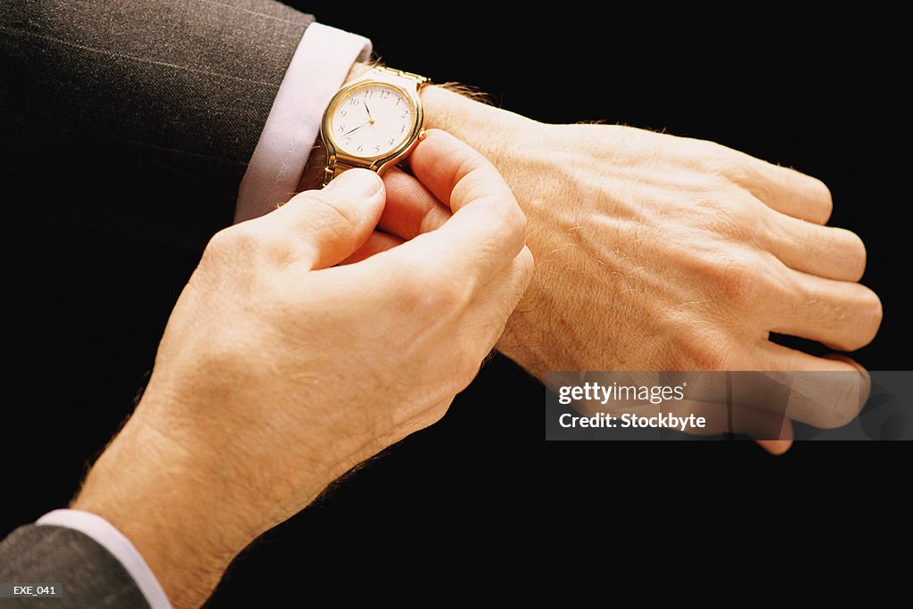 Close-up of man checking time