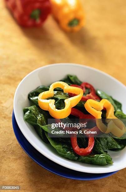 spinach salad with peppers - nancy green stock pictures, royalty-free photos & images