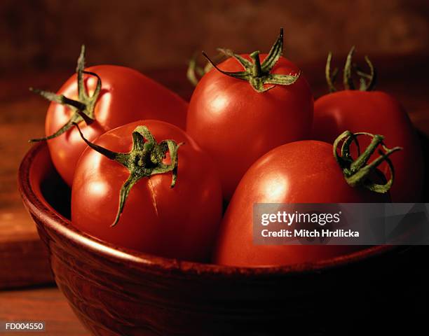 red tomatoes in bowl - beefsteak tomato stock pictures, royalty-free photos & images