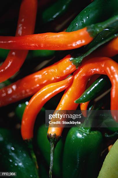 array of red and green chili peppers - pimenta malagueta verde imagens e fotografias de stock