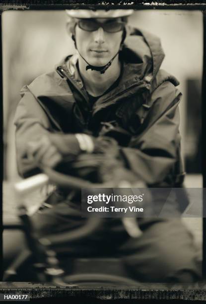 bike messenger leaning on handlebars (sepia tone) - instant print black and white stock pictures, royalty-free photos & images