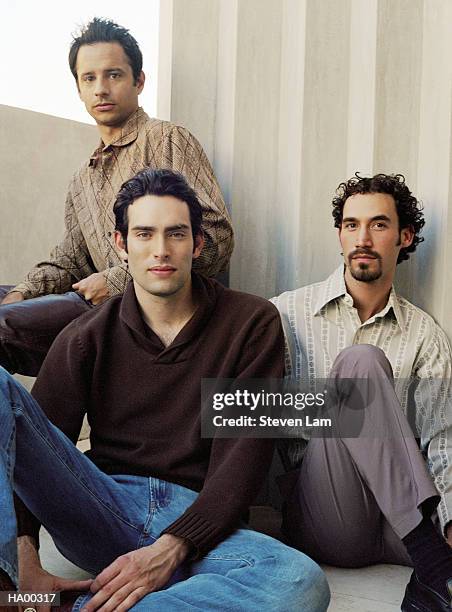 three young men sitting on floor, portrait - lam stock pictures, royalty-free photos & images