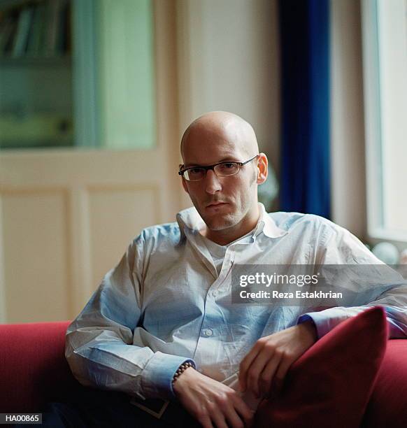 man with shaved head wearing reading glasses, portrait - shaved head ストックフォトと画像