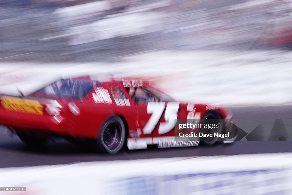 Stock car racing on track (blurred motion)