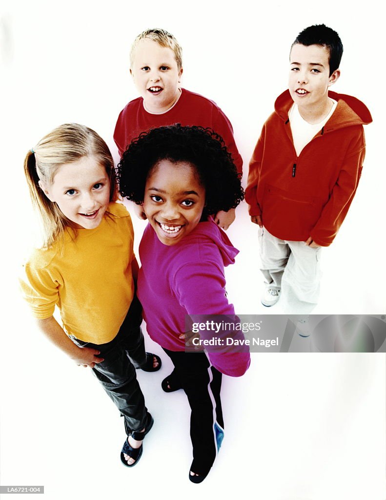 Multiracial children (10-12), smiling, portrait, elevated view