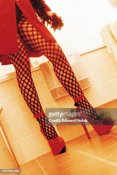 young woman wearing fishnet tights, low section - street walker stock pictures, royalty-free photos & images