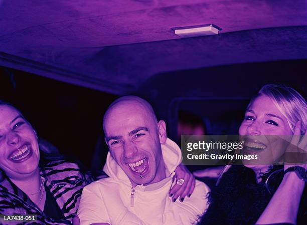group of young people in limousine, laughing (cross-processed) - male with group of females stock pictures, royalty-free photos & images