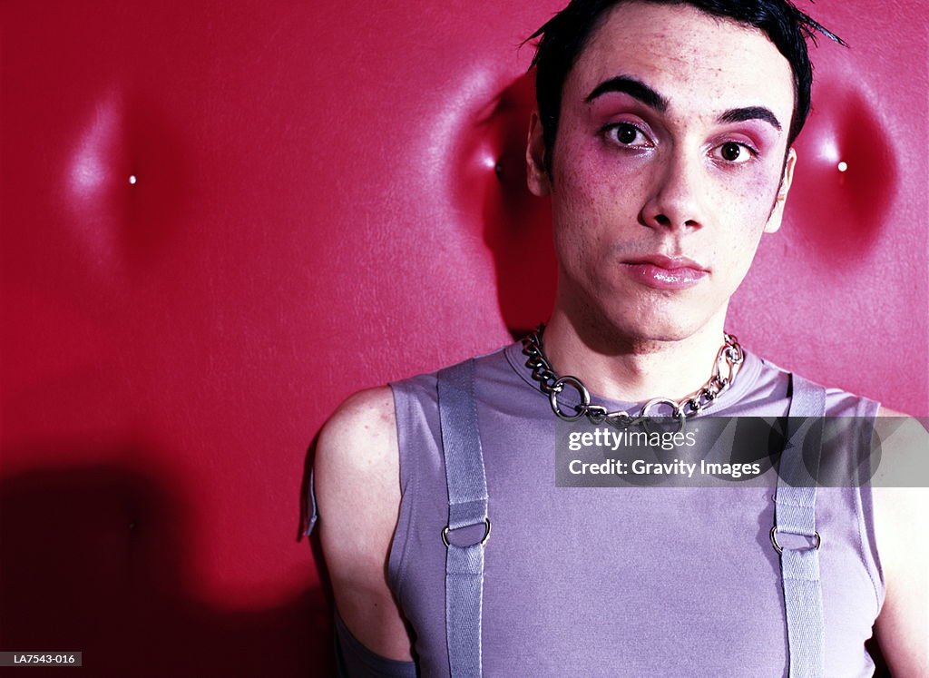 Young man wearing make-up, close-up, portrait