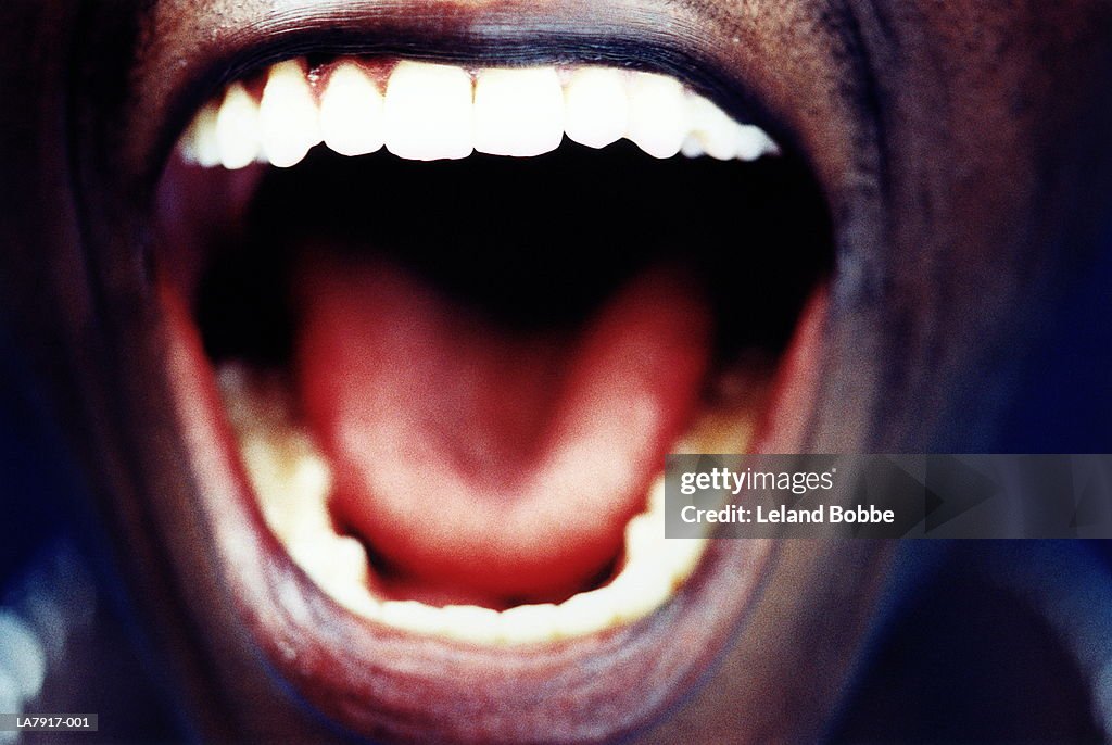 Man's open mouth, close-up