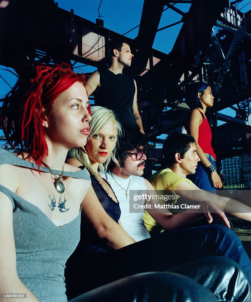 Group of young people in urban scene, portrait of blonde woman