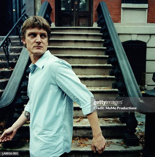 man walking down street, jersey city, new jersey, usa - paranoia stock pictures, royalty-free photos & images