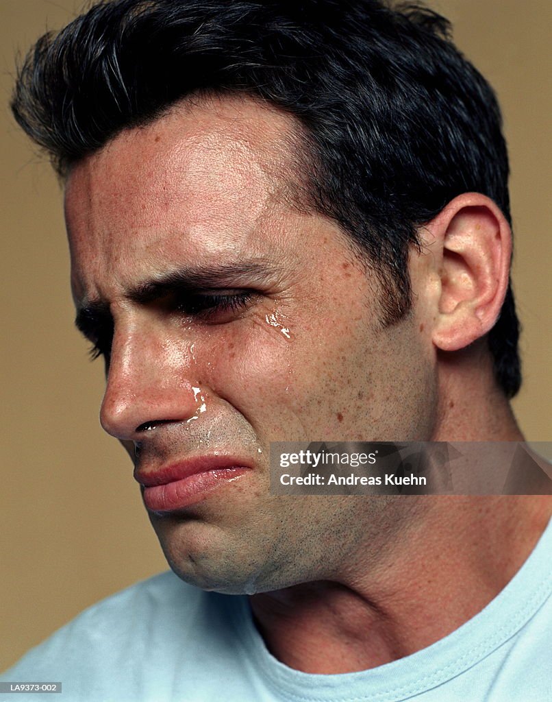 Man crying, profile, close-up