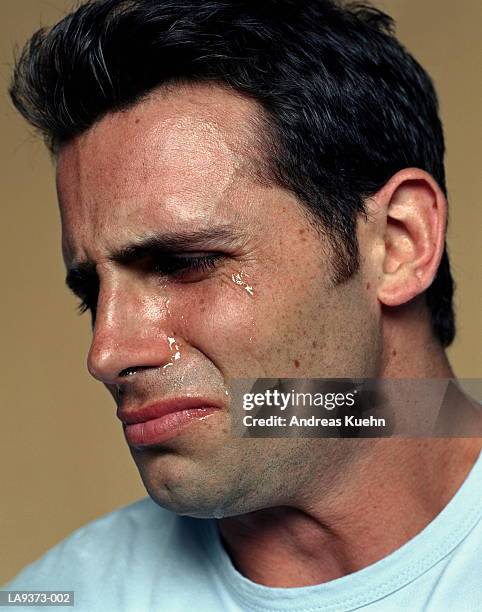 man crying, profile, close-up - man crying tears stock pictures, royalty-free photos & images