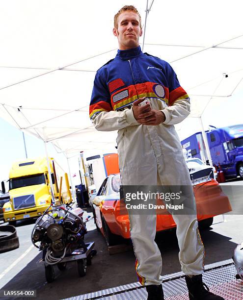 racing car driver in garage, portrait - race car driver portrait stock pictures, royalty-free photos & images