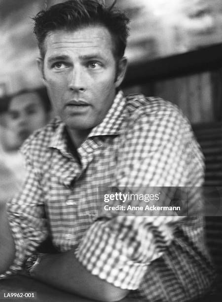 man wearing checked shirt, close-up (b&w) - checked shirt stock pictures, royalty-free photos & images
