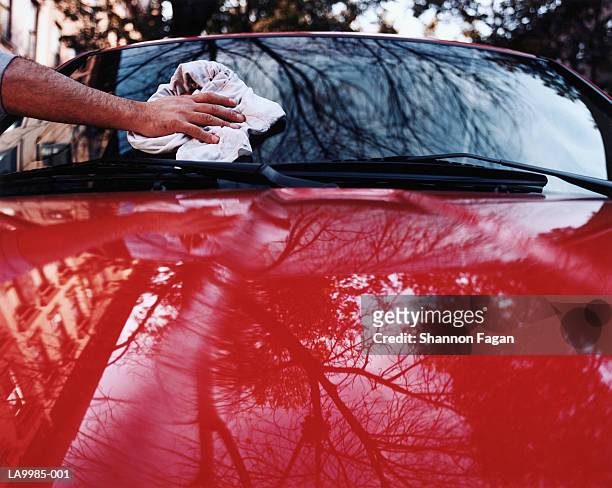 man wiping car windshield with cloth, close-up - clean car stock pictures, royalty-free photos & images