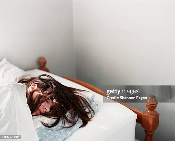 young woman sleeping in bed - sleeping and bed bildbanksfoton och bilder