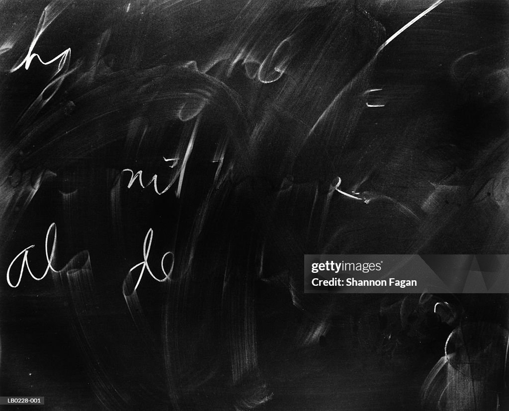 Chalkboard with half erased writing