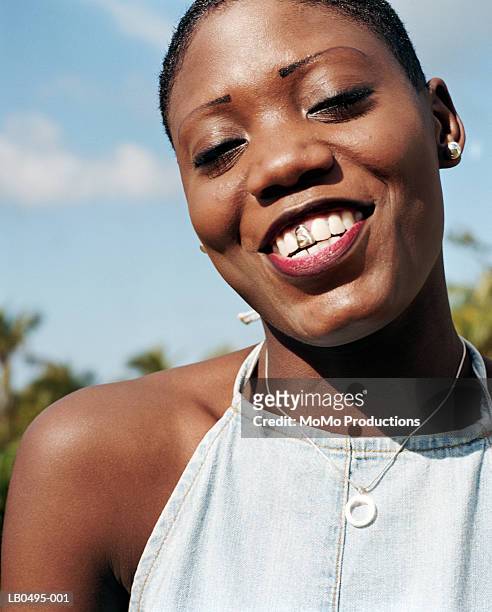 woman with gold tooth smiling, close-up, portrait - tooth cap stock pictures, royalty-free photos & images