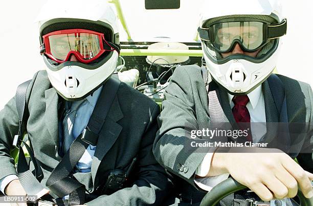 two businessmen sitting in dune buggy, close-up - dune buggy stock pictures, royalty-free photos & images