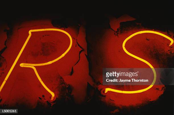 neon letters r and s at night - s night of too many stars america unites for autism programs stockfoto's en -beelden