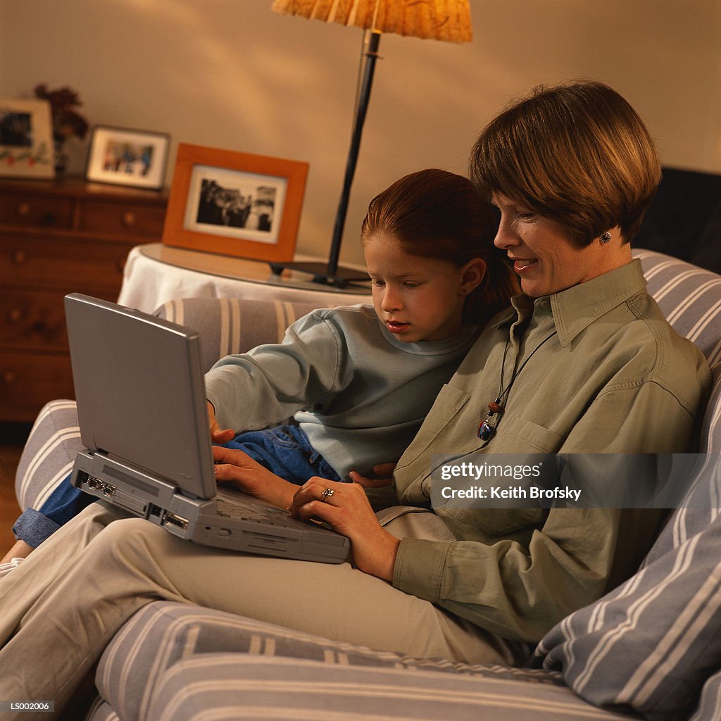 Mother and Daughter Using a Laptop Computer