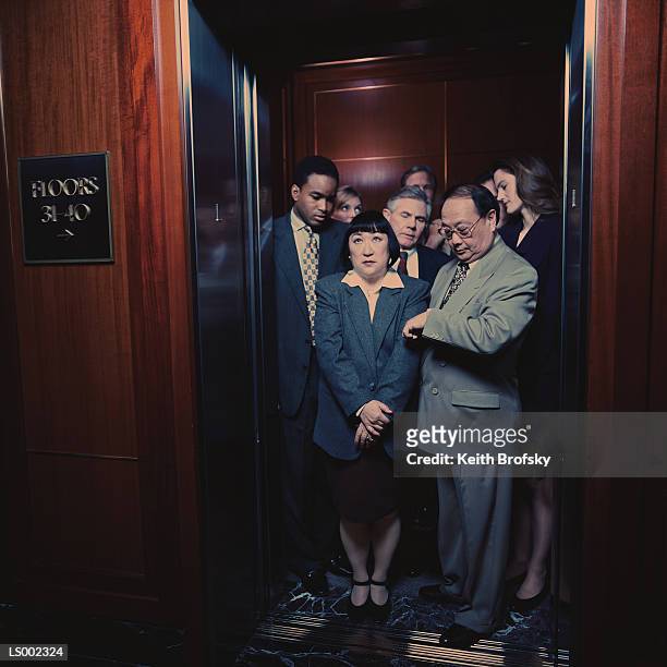 crowded elevator - crowded elevator stockfoto's en -beelden