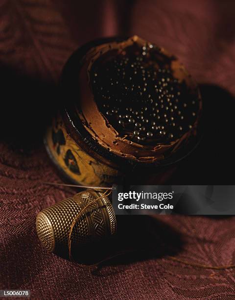 pin cushion and thimble - thimble stock pictures, royalty-free photos & images