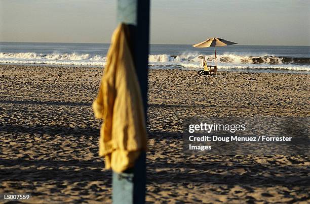 beach still life - stakes in the sand stock pictures, royalty-free photos & images