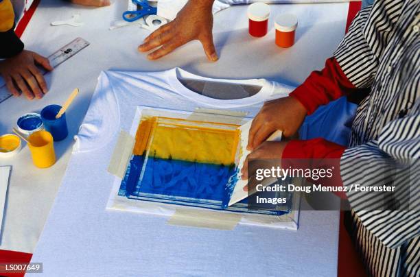 children sikscreening tee shirts - silk screen stock pictures, royalty-free photos & images