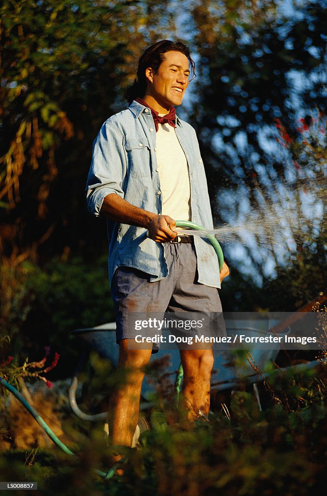 Man Watering Plants