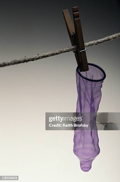 hanging condom - phallus shaped stock pictures, royalty-free photos & images