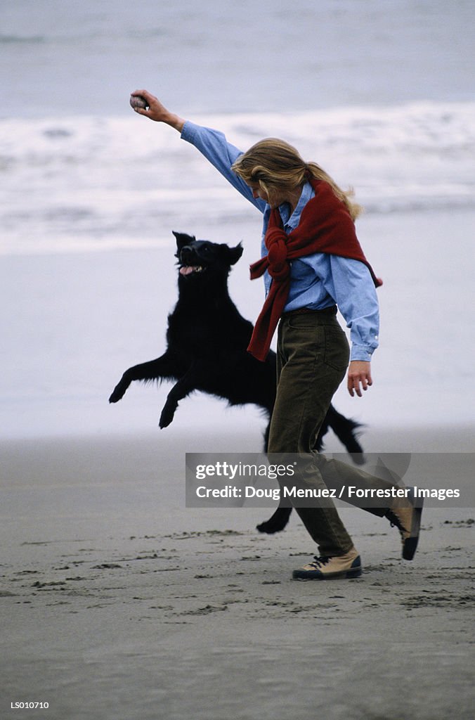 Woman Playing with Dog