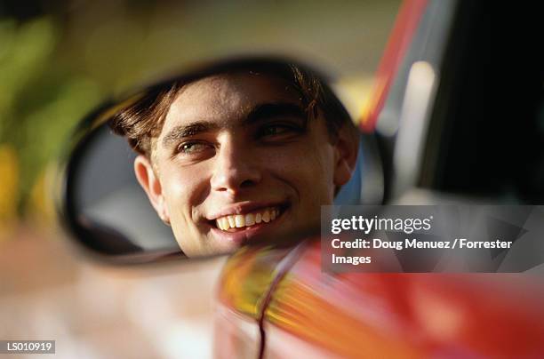 man looking in mirror - side view mirror stock pictures, royalty-free photos & images