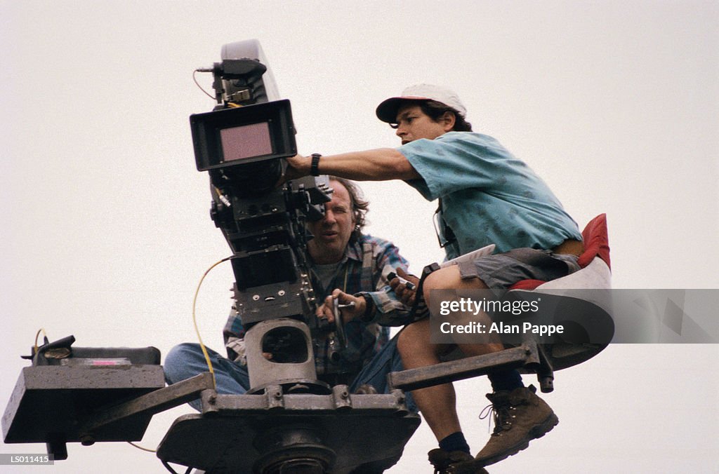 Director and cameraman on crane filming