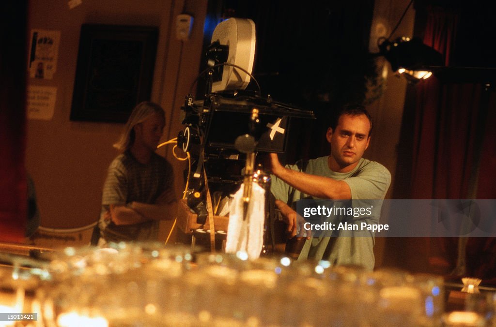 Cameramen operating camera in studio