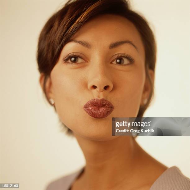 woman pursing her lips - greg stock pictures, royalty-free photos & images