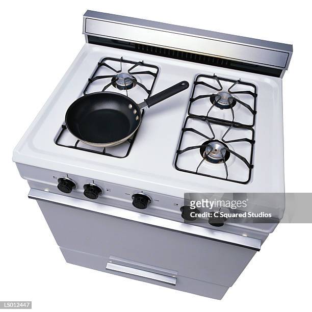 stove with pan - pan imagens e fotografias de stock