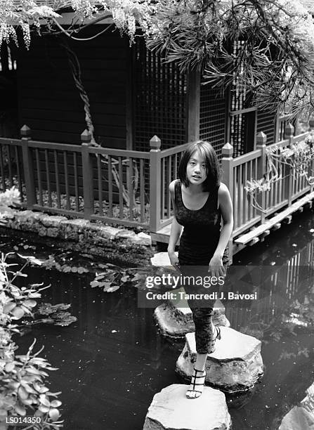 woman on stone walkway through water - bavosi ストックフォトと画像