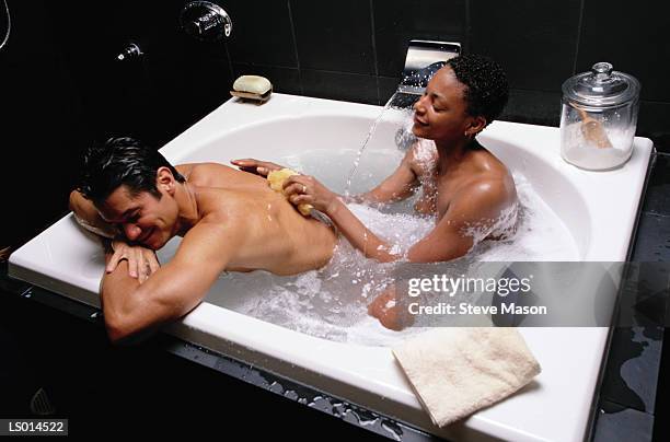 couple in hot tub - balneotherapy stock pictures, royalty-free photos & images
